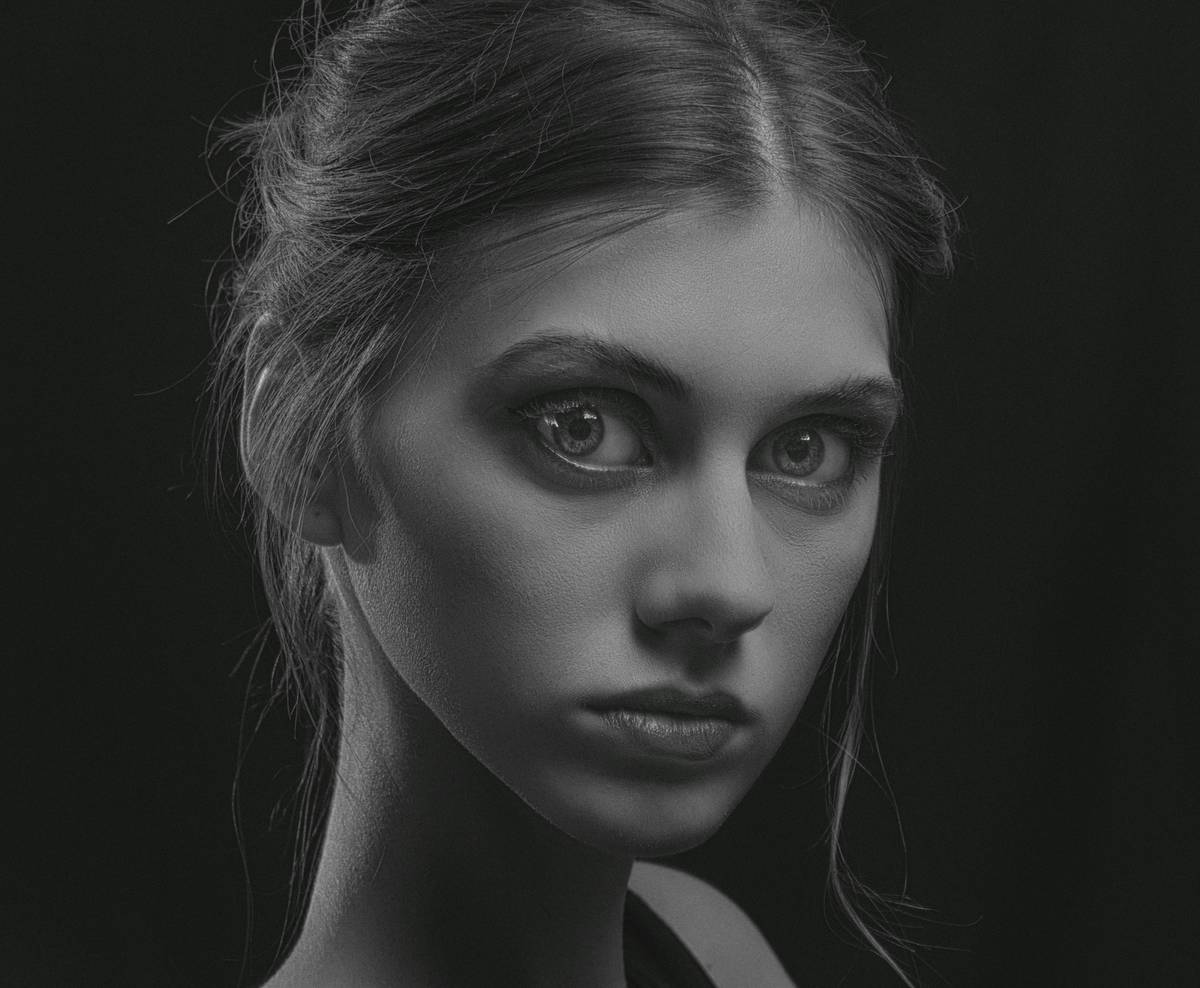 Model demonstrating cheekbone define technique with contour and highlight on hollows and high points
